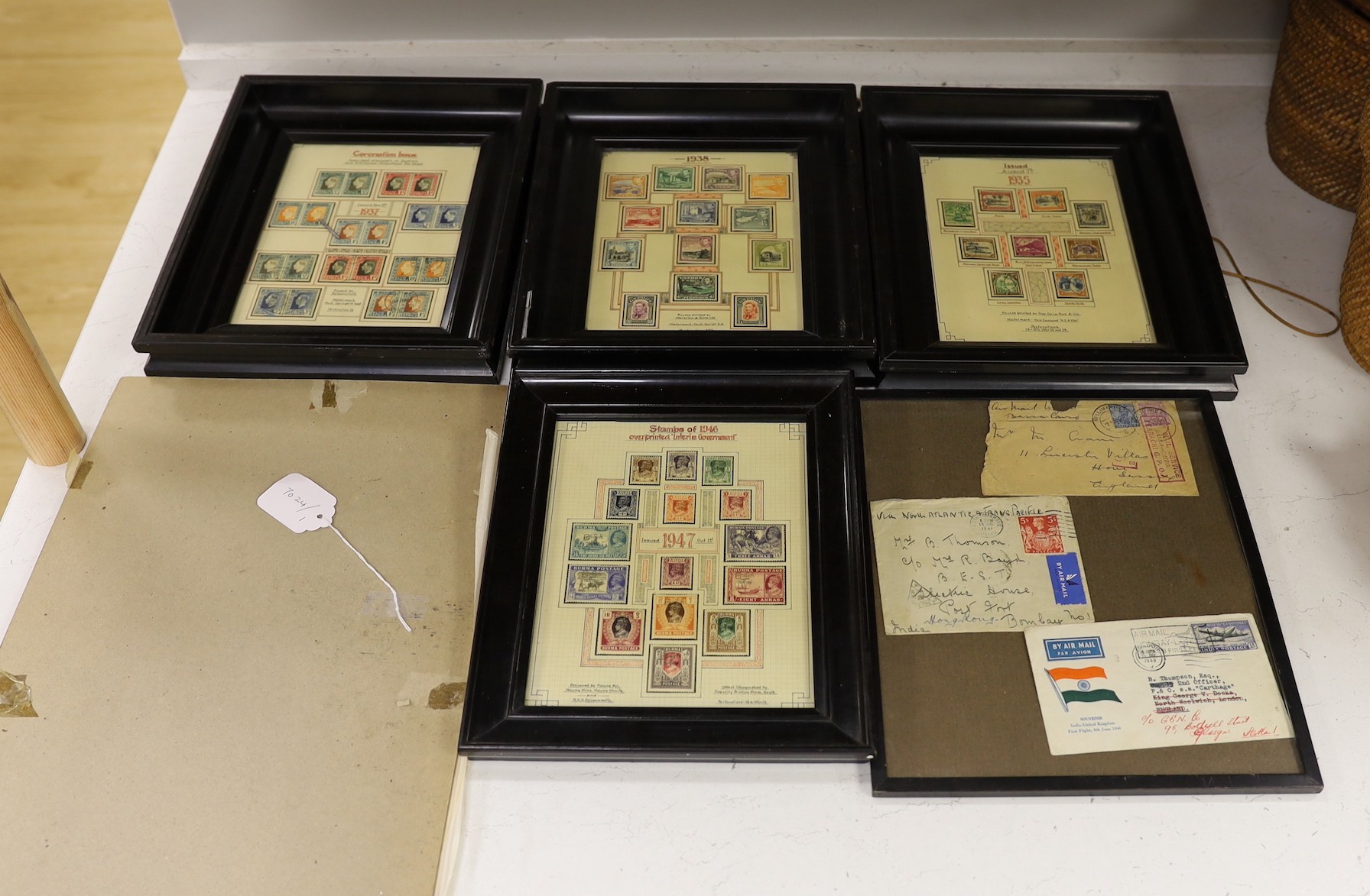 A collection of framed 1980's commemorative stamps, together with full sheets Guernsey, North Ireland and Scotland